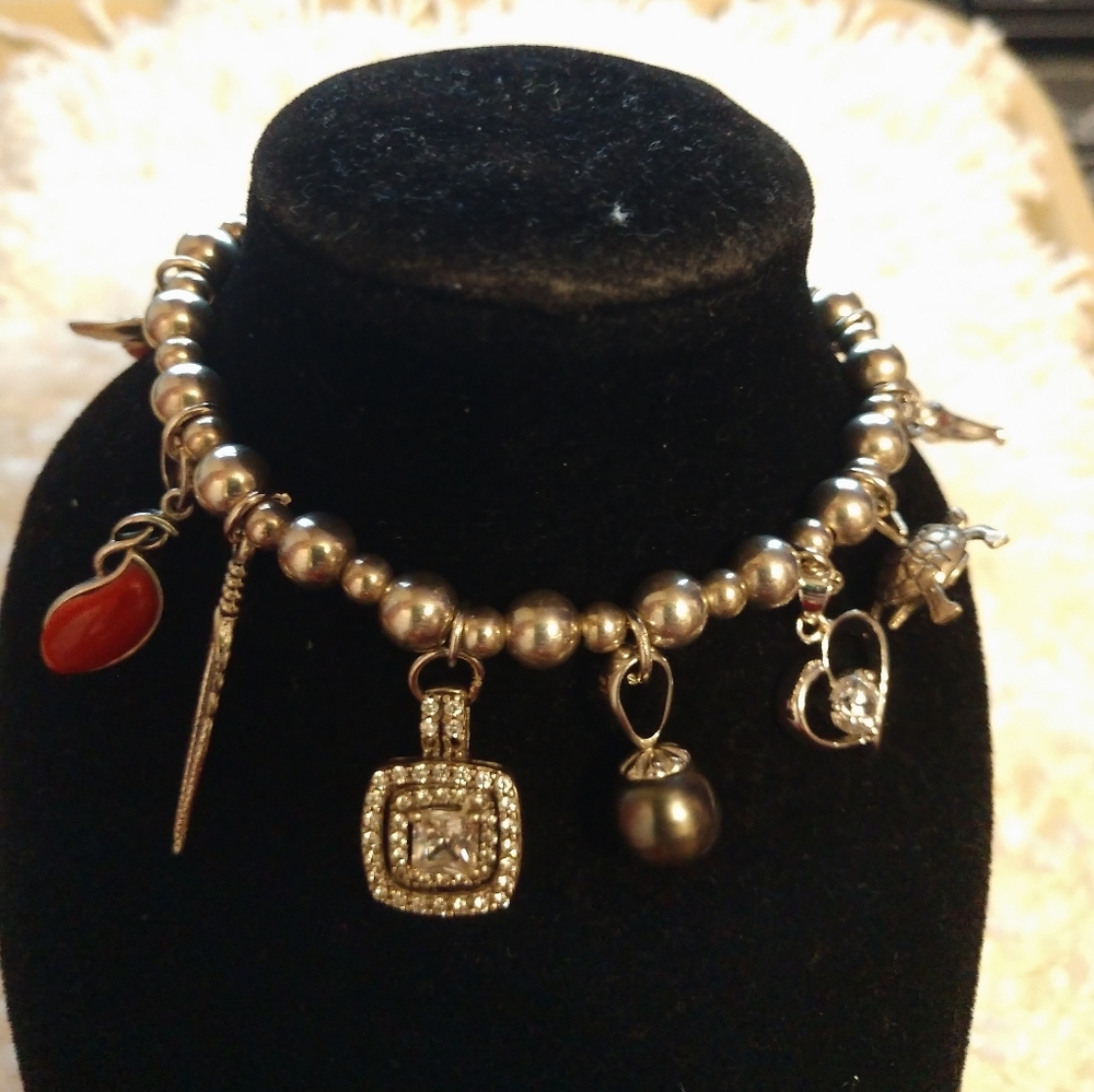 Navajo sterling silver beaded bracelet with charms